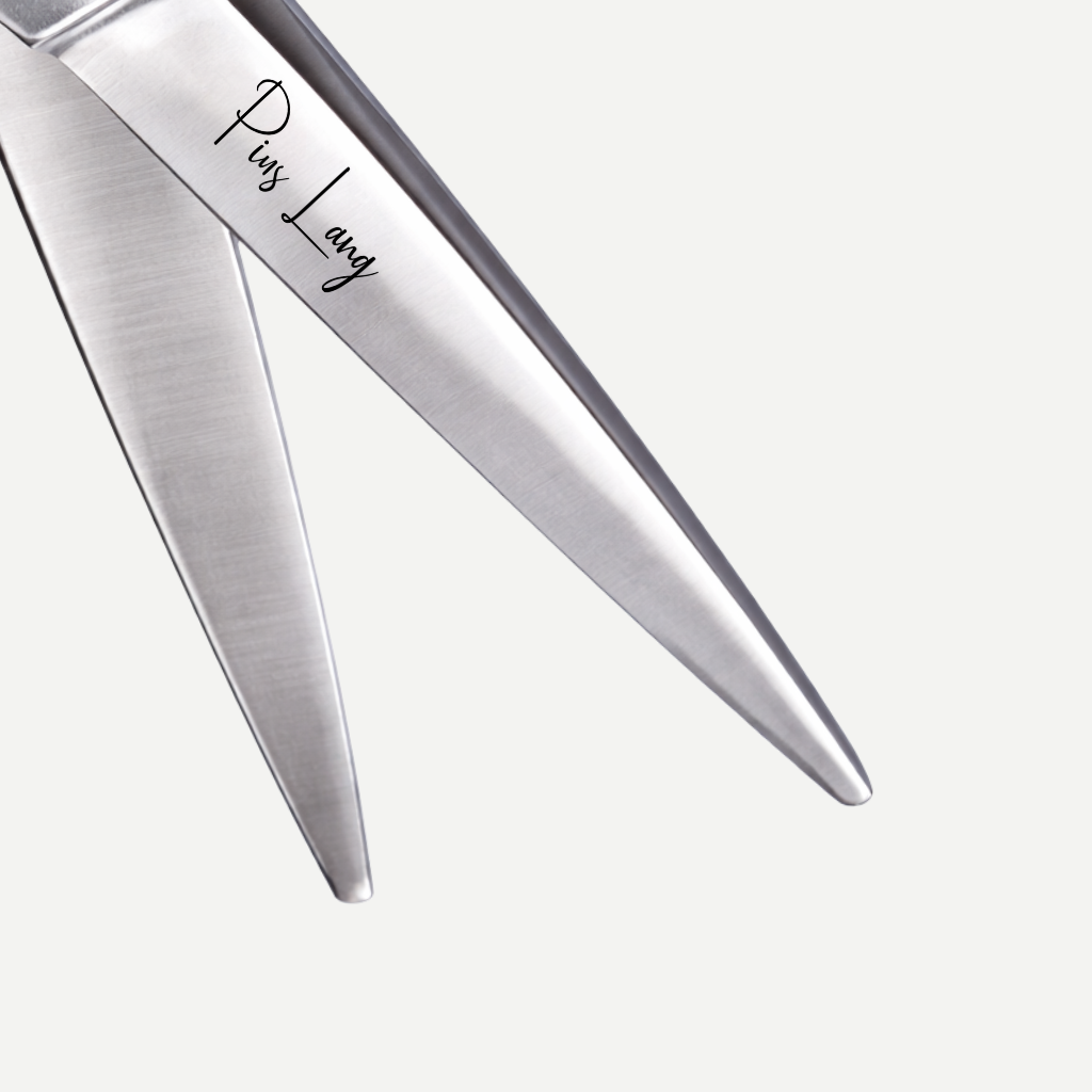 Close-up of PIUS LANG scissors blade edge, showing precision convex grinding